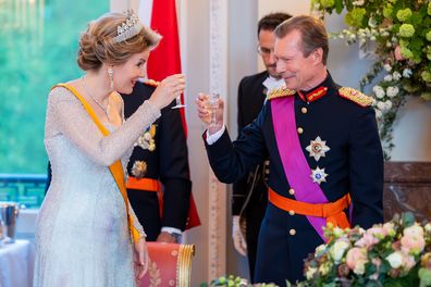 Queen Mathilde of Belgium and Grand Duke Henri of Luxembourg bring out a toast during a gala dinner at the Royal Castle of Laeken 