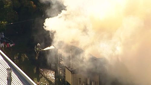 Four fire trucks were on scene to attack the blaze. (9NEWS)