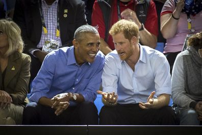 Former U.S. President Barack Obama and Prince Harry watch wheelchair basketball at the Invictus Games in Toronto.