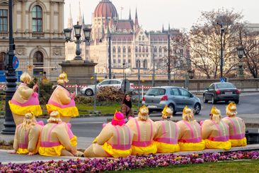 Members of a bachelor party have a short rest on Adam Clark Square - Budapest, Hungary
