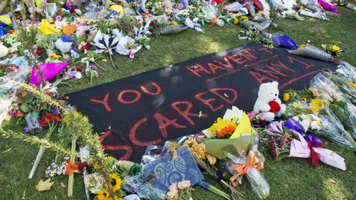 Floral tributes and messages are seen along Rolleston Avenue in Christchurch.