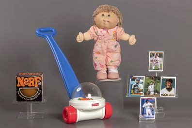 This photo provided by the National Toy Hall of Fame shows their 2023 inductees. From left, NERF, Fisher-Price Corn Popper, Cabbage Patch Kids, and baseball cards. They will be permanently installed at the Toy Hall of Fame in Rochester, NY. (National Toy Hall of Fame via AP)