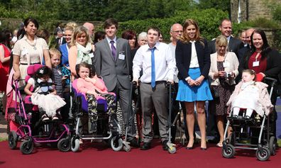 Princess Beatrice poses for photographs with children and families at the end of her visit to the Forget Me Not Children Hospice in Huddersfield. 