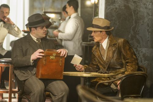 Josh Gad, left, and Johnny Depp in a scene from Murder on the Orient Express. (AAP)