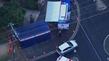 A woman in her 50s has been injured after being shot by police in Melbourne after she allegedly ran at them with a knife.