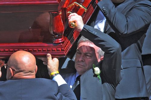 Borce Ristevski, husband of Karen Ristevski, (bottom right) carries the coffin out of the church as friends attend the funeral of Karen Ristevski at St Johns Uniting Church in Essendon. Picture: AAP