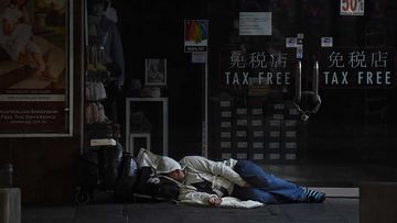 A man sleeps on George street in Sydney&#x27;s CBD.