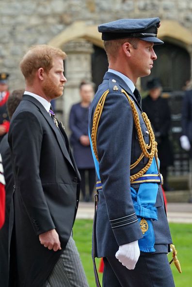 Prine Harry, The Duke of Sussex and Prince William, Prince of Wales follow the State Hearse carrying the coffin of Queen Elizabeth II, draped in the Royal Standard with the Imperial State Crown and the Sovereign's Orb and Sceptre, as it arrives at the Committal Service held at St George's Chapel in Windsor Castle on September 19, 2022.