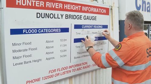 A State Emergency Service member at the Dunolly Bridge Gauge this morning.