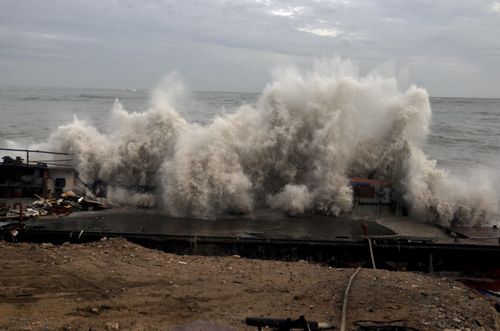 A waves crashes on the Arabian Sea coast in Porbandar, Gujarat, India. (AP Photo)