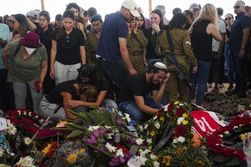 Mourners attend the funeral of the Kotz family in Gan Yavne, Israel, Tuesday, Oct. 17, 2023. 