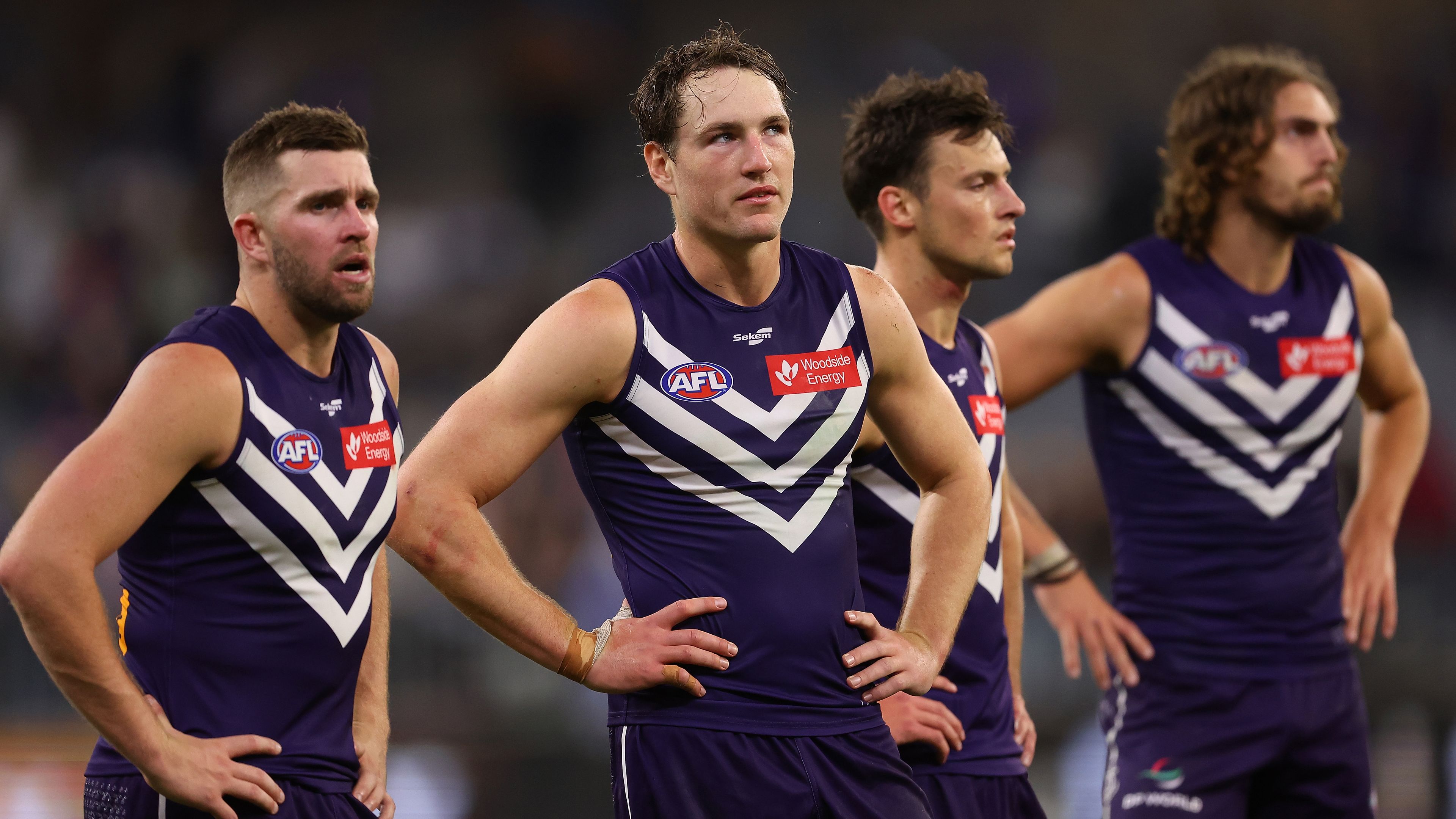 PERTH, AUSTRALIA - APRIL 21: Luke Ryan, Brennan Cox, Ethan Hughes and Luke Jackson of the Dockers look on after being defeated during the round six AFL match between Fremantle Dockers and Western Bulldogs at Optus Stadium, on April 21, 2023, in Perth, Australia. (Photo by Paul Kane/Getty Images)