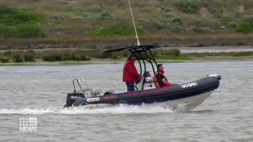 Locals patrolled on the ground alongside surf life savers after reports the father and son went missing. 