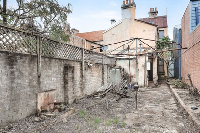 Neglected Redfern terrace with a backyard like a deserted wasteland sells at auction for $1.25 million