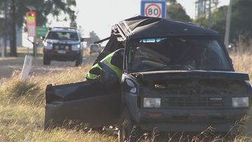 A woman is fighting for her life after a fatal crash in Dalby