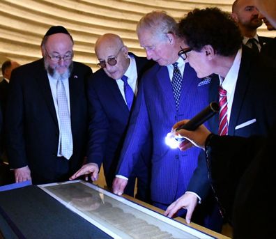 The Prince of Wales hears about the Shrine of the Book exhibition which houses the Dead Sea Scrolls, the world's oldest biblical manuscripts. HRH had the opportunity to view the scrolls inside the Shrine of the Book.