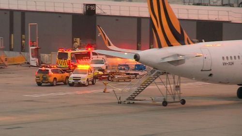 The plane was met by paramedics on the tarmac.