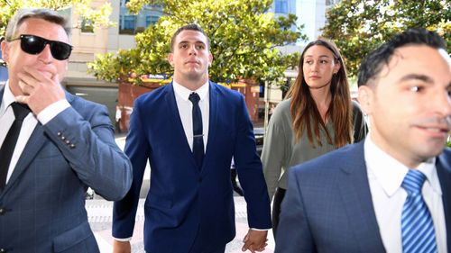 Canterbury Bankstown Bulldogs NRL player Adam Elliott (second left) arrives at the Downing Centre Court in Sydney on obscene exposure charges.