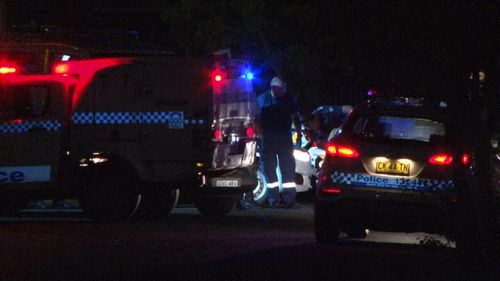 Forensic police spent the night examining the apartment block. (9NEWS)