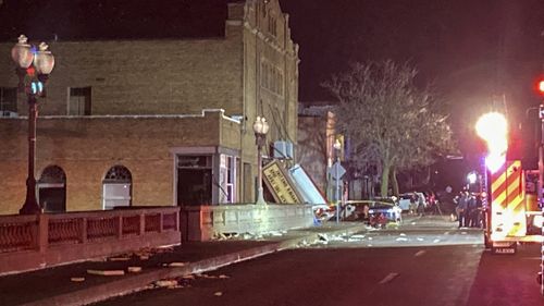 The fallen marquee is seen at the front entrance of the Apollo Theatre where a roof collapsed during a tornado in Belvidere, Ill., during a heavy metal concert, late Friday, March 31, 2023. 