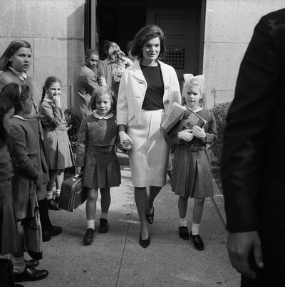 <p>This iconic image from 1964, shows the late Mrs. Jacqueline Kennedy picking up her daughter, Caroline, 6, and her niece, Sydney Lawford, 8, from Convent of the Sacred Heart, just off Fifth Avenue, New York.</p>