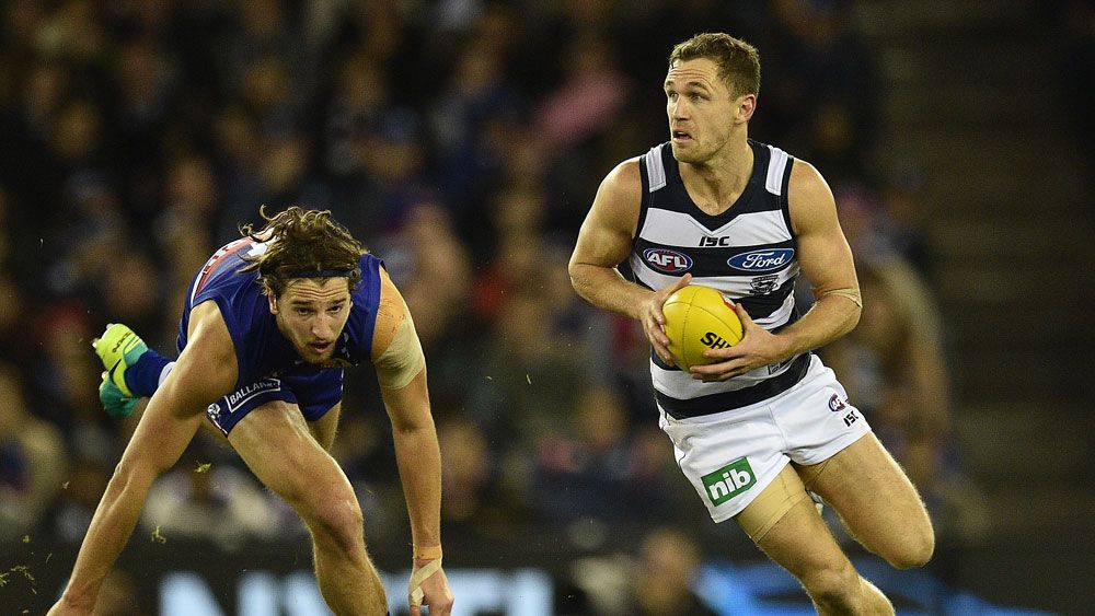 Cats cruise past Dogs to go top in AFL