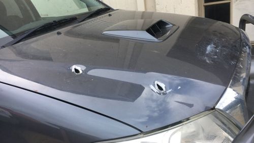 A car was peppered with bullet holes in the city's north. (9NEWS)