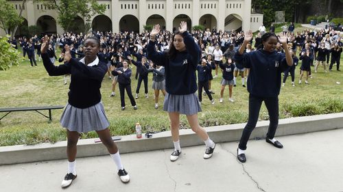 The celebration included British and American flags, singing, dancing and tea and cake. Picture: AAP.