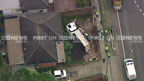 Truck overturns in front of house in Sydney’s west