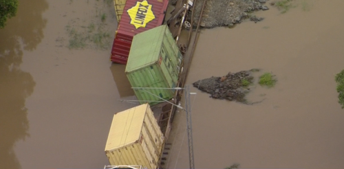 This freight train derailed at Traveston near Gympie. It was swept off the tracks by the raging floodwaters.