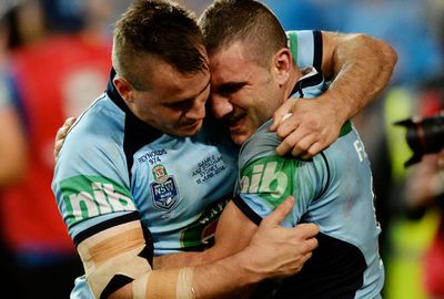 Farah and Josh Reynolds in an emotional embrace.