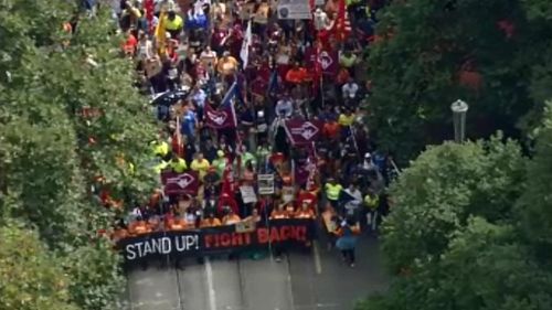 Protesters marching through the Melbourne CBD over federal government policies. (9NEWS)