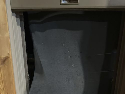 A broken screened window is seen that a black bear broke through to enter a house, Thursday, Aug 3, 2023, in Luther, Montana where it was shot by the homeowner. (Seeley Oblander via AP)