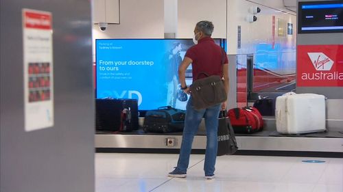 Passengers from Adelaide flight arrive in Sydney.