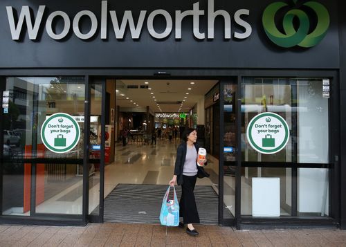 A customer exits a Woolworths Group Ltd. supermarket after purchasing paper towels in Sydney, Australia, on Wednesday, Mar. 4, 2020. Australia's four biggest lenders have heeded the prime ministers plea to "do their bit" to help the country weather the expected economic hit from the coronavirus, by passing on the central banks latest interest-rate cut in full. Photographer: Brendon Thorne/Bloomberg