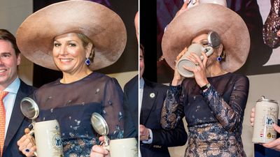 Queen Maxima of the Netherlands scolls beer from a tankard