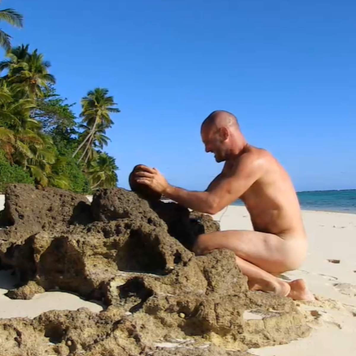 Naked on a desert island