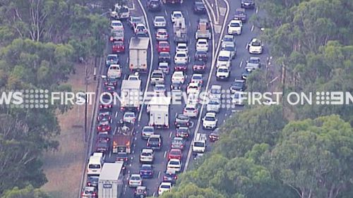 Traffic on the Hume Highway at Lansvale is at a standstill due to the nearby factory fire. (9NEWS)