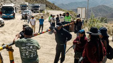 Miners&#x27; relatives wait at the entrance of the mine following the fire.