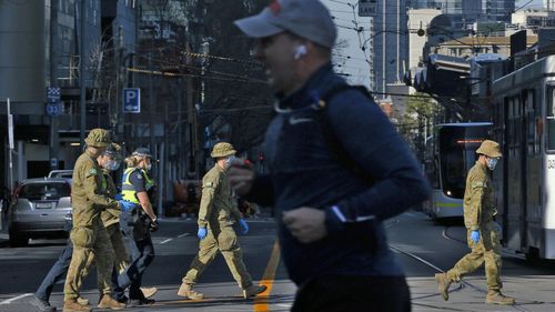 Members of the ADF (Australian Defence Force) patrol with Members of Victoria Police on August 02, 2020 in Melbourne.