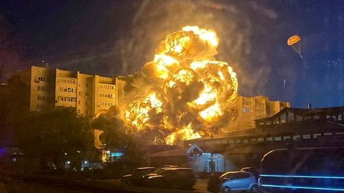Flames and smoke rise from an apartment building after a warplane crashed into a residential area in Yeysk, Russia