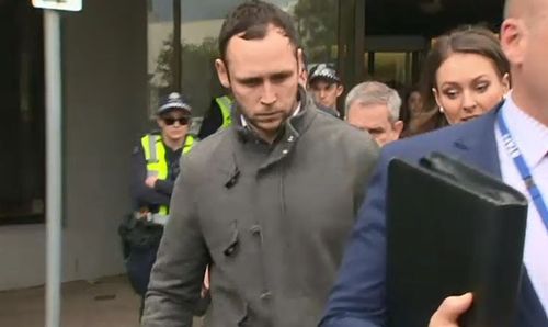 Mr Wells was escorted out of court with a huge police presence after being again released on bail. Picture: 9NEWS