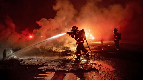 Firefighters battle California blazes.