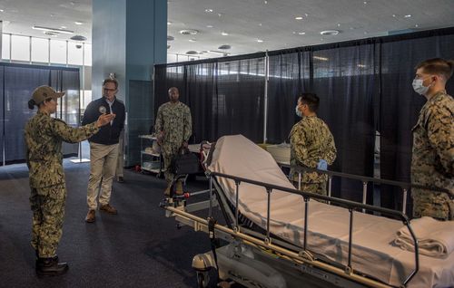 Acting Secretary of the Navy Thomas Modly is toured through the patient transfer process at the Military Sealift Command hospital ship USNS Mercy.