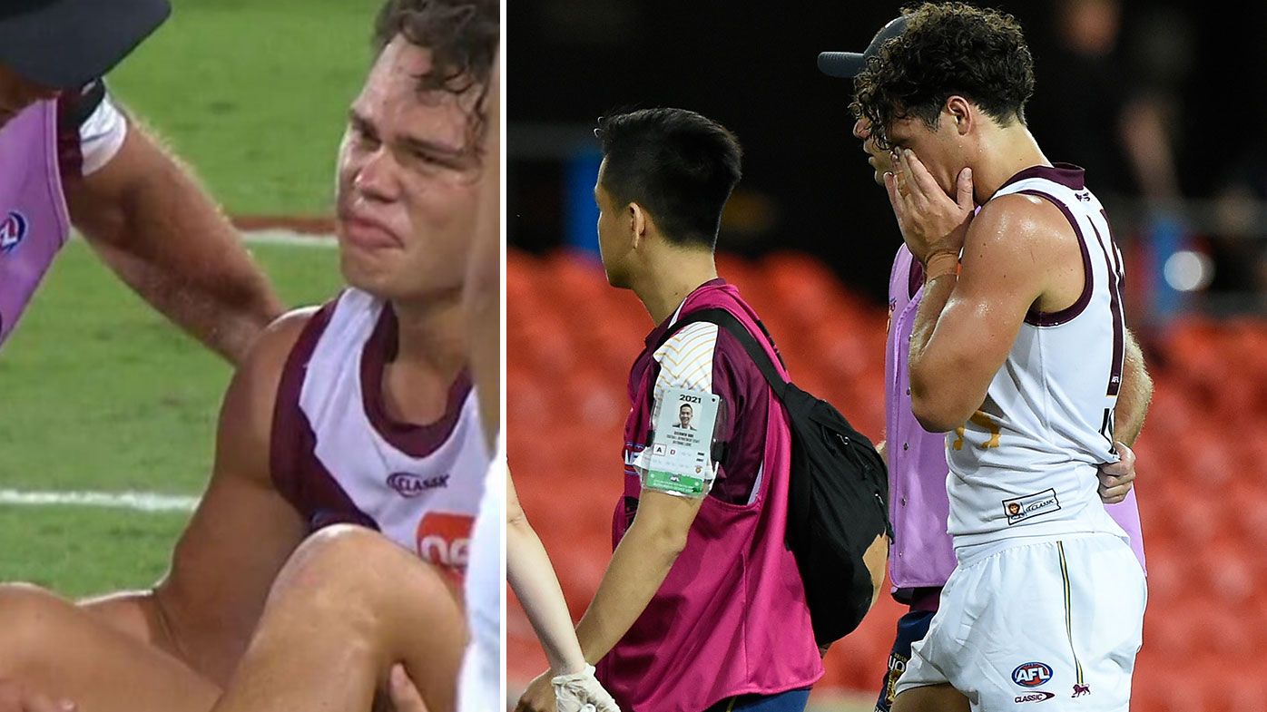 Brisbane Lions young star Cameron Rayner goes down with suspected ACL injury 