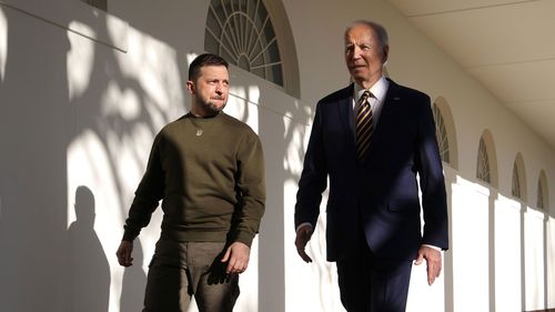 President Joe Biden, right, and Ukraine President Volodymyr Zelenskyy walk down the Colonnade as they make their way to the Oval Office at the White House on December 21 in  2022 in Washington, DC. 