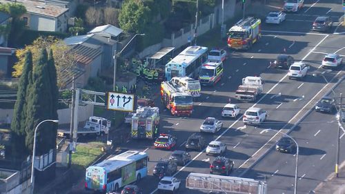 Two people are in hospital after a car crashed into a bus shelter in Drummoyne, Sydney.