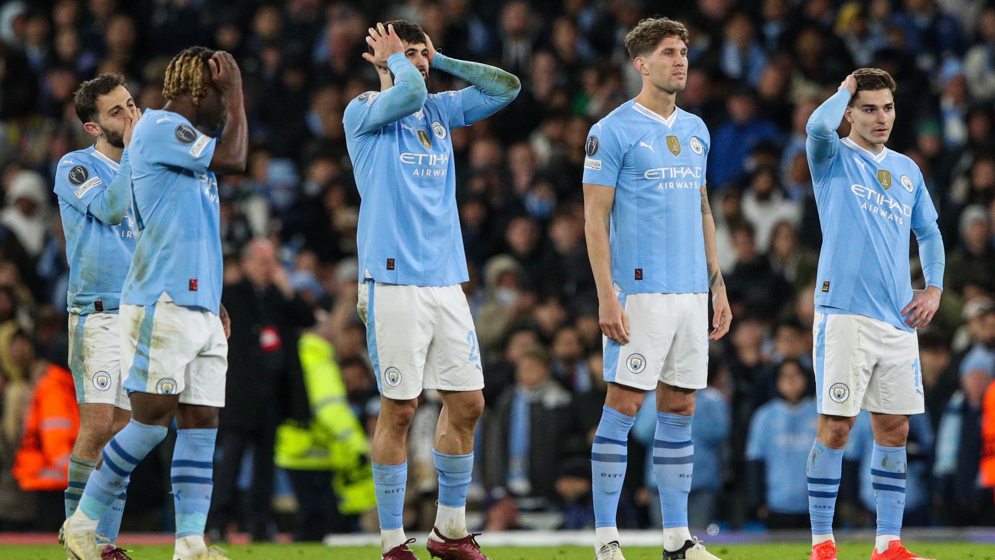 Manchester City players react during the shootout.