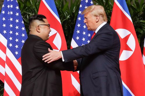 Trump shakes hands with North Korea leader Kim Jong Un at the Capella resort on Sentosa Island, in Singapore.