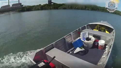 The police officer commandeered another boat at a nearby ramp to chase down the loose tinny. 